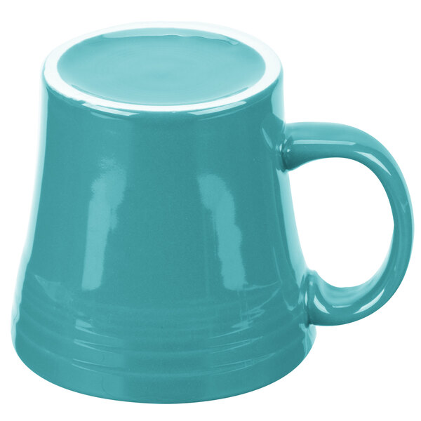 A close-up of a blue Fiesta mug with a handle.