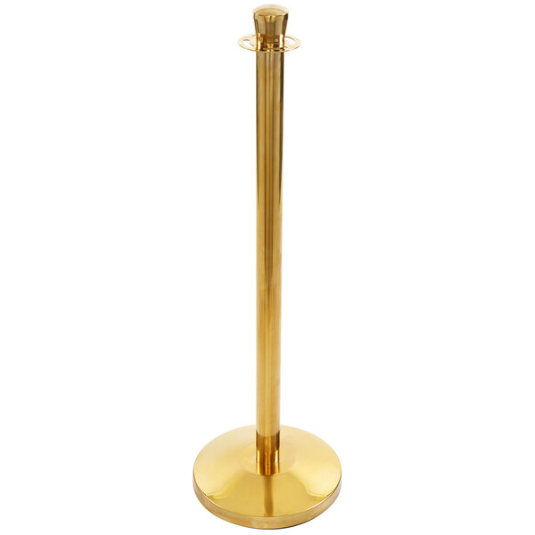 A close up of a gold Lancaster Table & Seating rope-style crowd control stanchion.