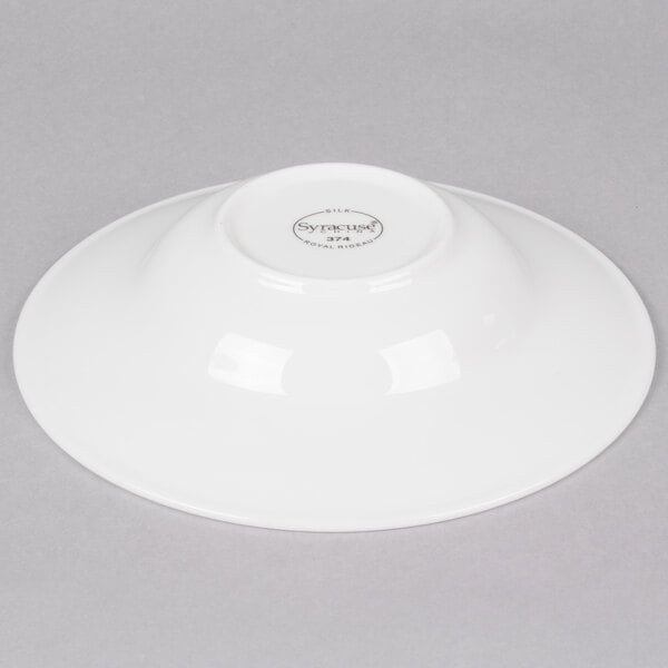 A white Reserve by Libbey wide rim soup bowl on a gray surface.