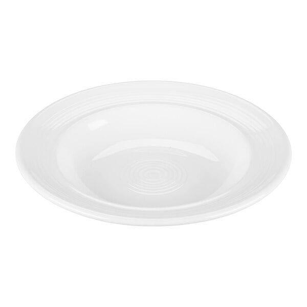 A white Tuxton soup/pasta bowl with a circular edge.
