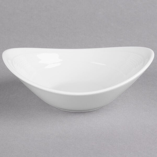 A white Reserve by Libbey oval bowl on a gray surface.