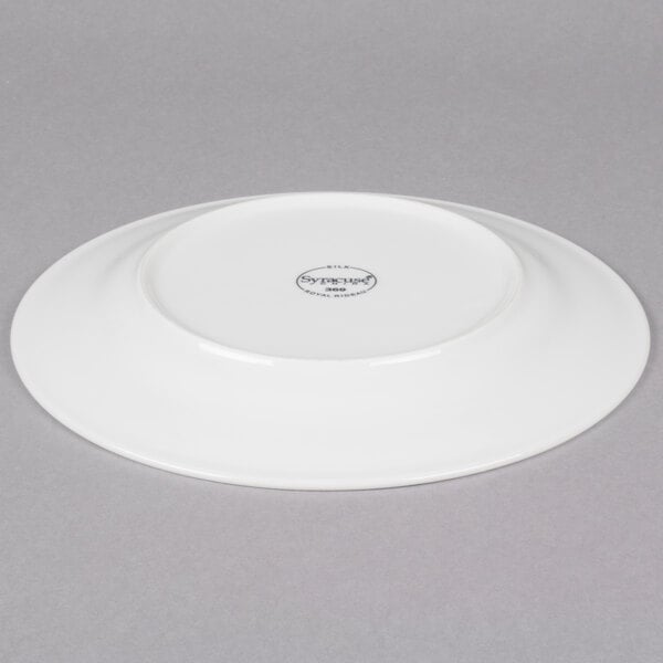 A white Reserve by Libbey porcelain plate with a circular design on the rim.