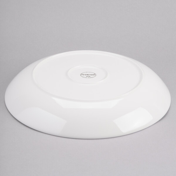 A white porcelain coupe serving bowl with a lid on top.