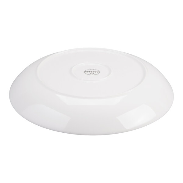 A white, round porcelain bowl shown upside down on a white background.
