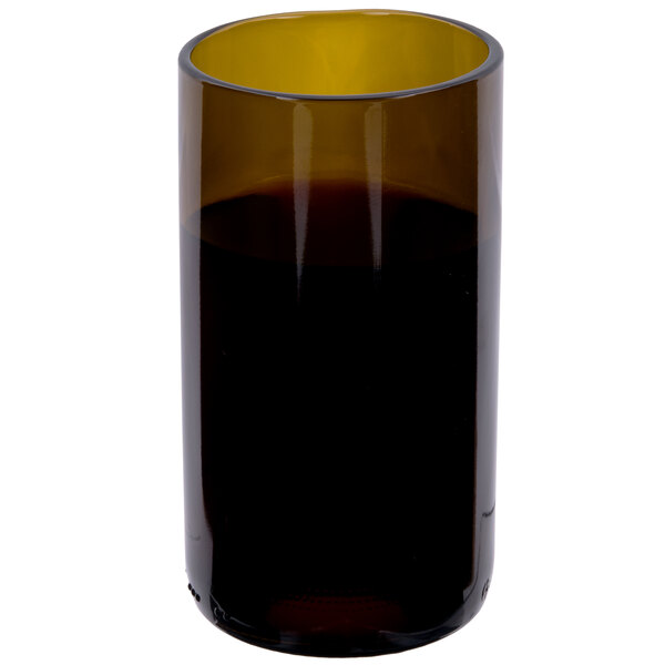 An Arcoroc amber wine tumbler filled with brown liquid.