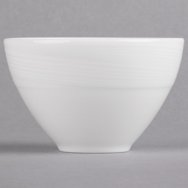 A white bowl with a wavy design on it.