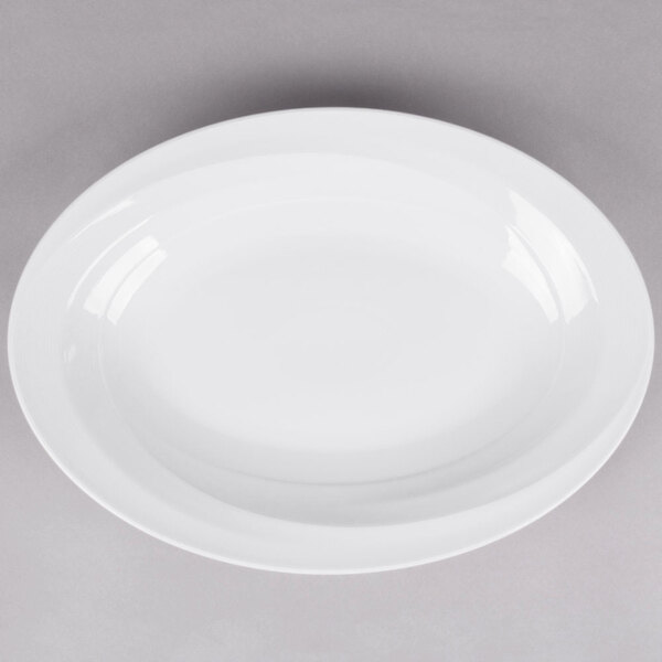 A white Reserve by Libbey narrow rim porcelain platter with a curved edge.
