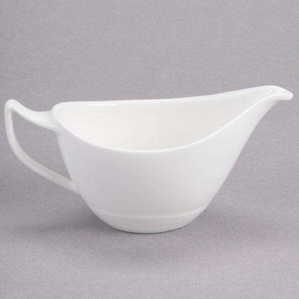 A white Reserve by Libbey Royal Rideau porcelain sauce boat.