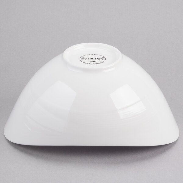 A white Reserve by Libbey Silk oval porcelain bowl on a gray background.