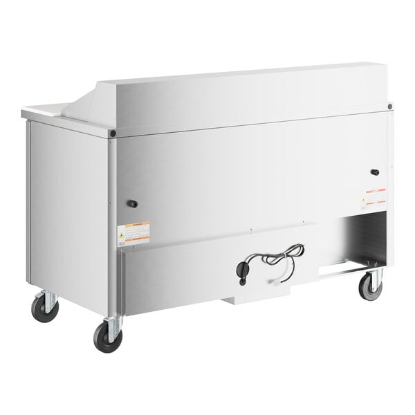 A white True refrigerated sandwich prep table with stainless steel top and wheels.