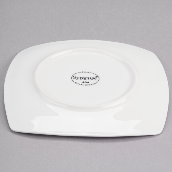 A white Reserve by Libbey Square porcelain plate with black text on the rim.