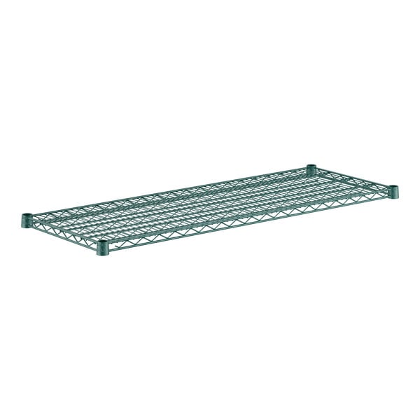 A close-up of a green metal wire shelf.