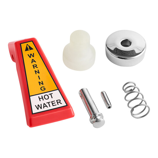 A red and yellow warning sign, a screw, and a spring on a counter.