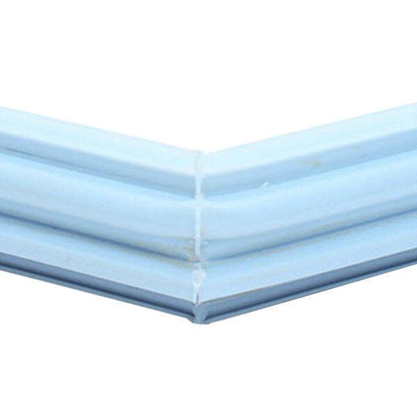 A close-up of a white corner of a Delfield magnetic door gasket.