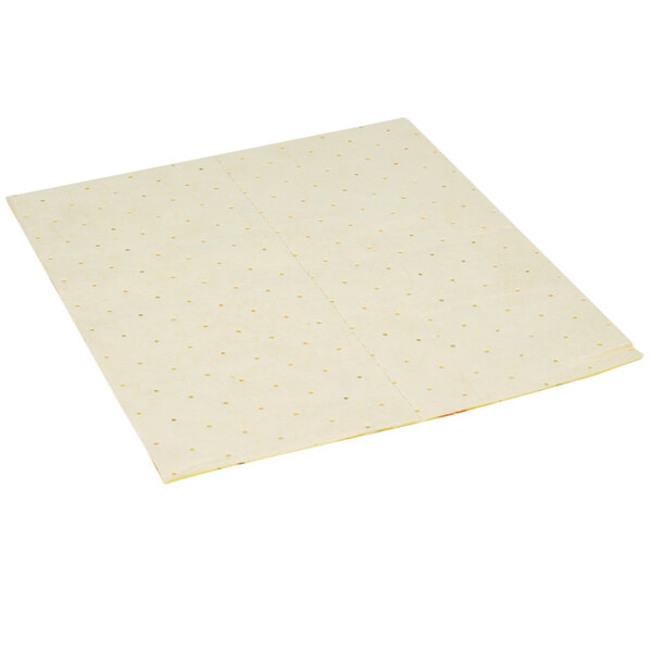 A white paper Spilfyter absorbent pad with yellow dots.