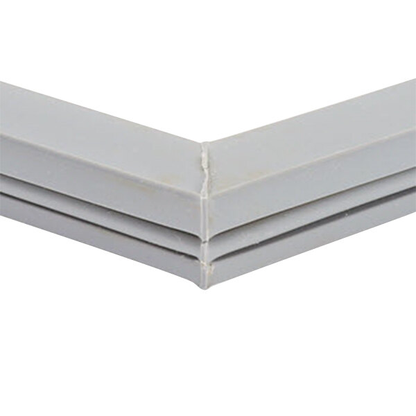 A close up of a gray corner of a Delfield magnetic door gasket.