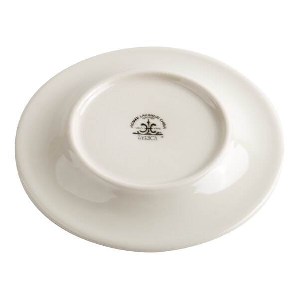 A white ceramic plate shown upside down, displaying a logo and text at the center of its base.