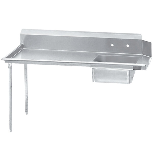 A stainless steel Advance Tabco dishtable with a sink on the left.