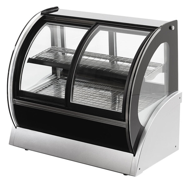 A Vollrath curved refrigerated countertop display case with glass doors.