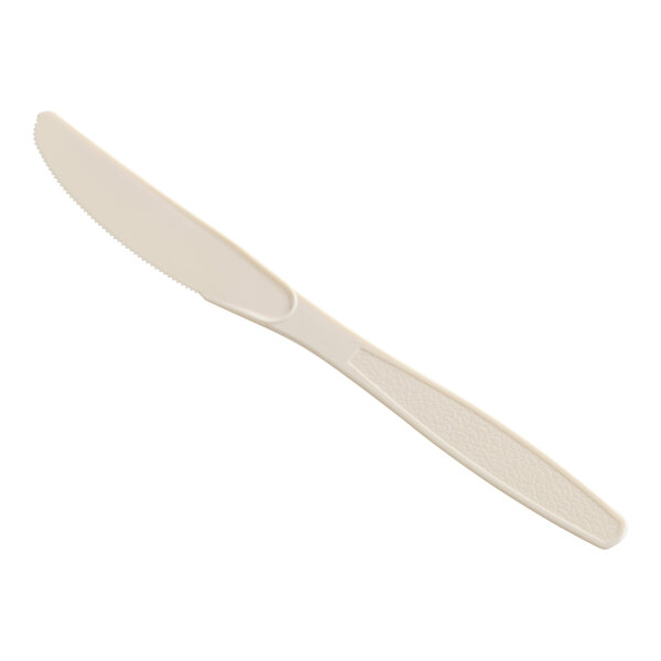 A beige heavy weight polystyrene plastic knife.