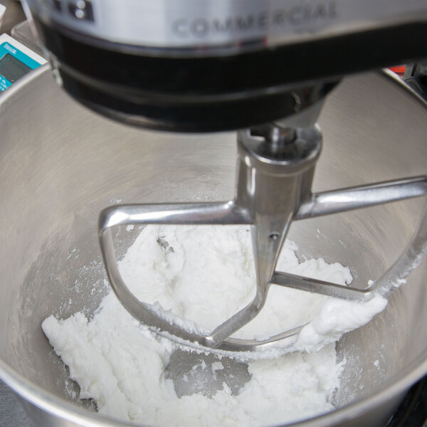 A mixer mixing Golden Barrel Creme Fondant mix in a bowl.