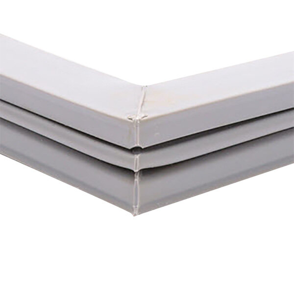 A close up of a gray plastic corner of a Traulsen equivalent magnetic door gasket.