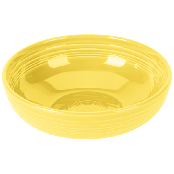 A yellow Fiesta china bistro bowl with a white background.