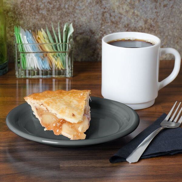 A Fiesta Slate China appetizer plate with a slice of pie on it next to a white mug of coffee.