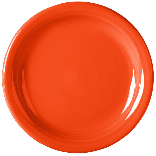 An orange Fiesta appetizer plate with a white background.
