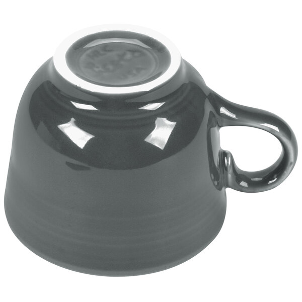 A grey Fiesta china cup with a white handle.
