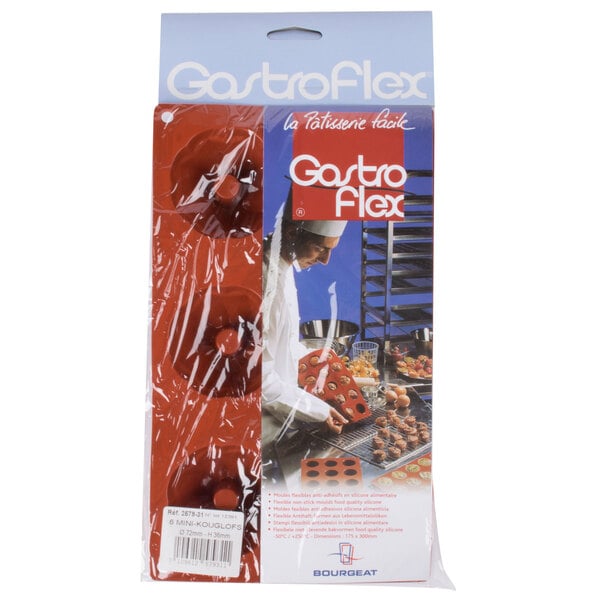 A Matfer Bourgeat orange silicone mini cake mold with 6 Kugelhopf compartments.