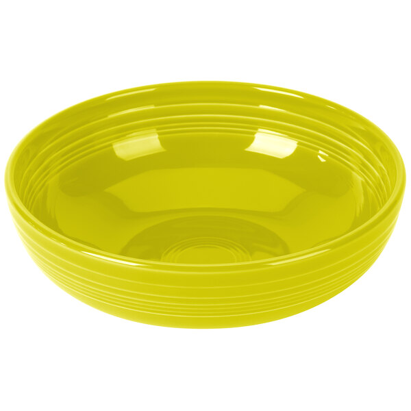 A yellow Fiesta China Bistro Bowl with a white rim on a white background.