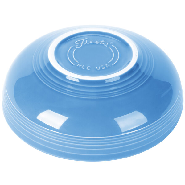 A Fiesta Lapis blue china bowl with a white rim.