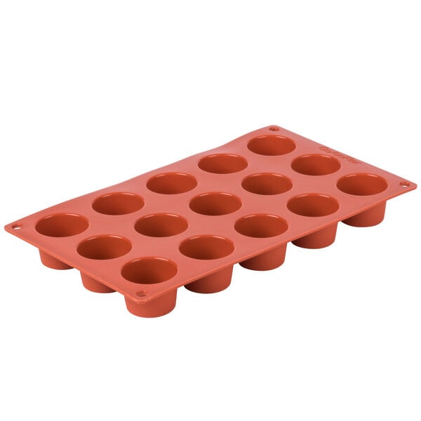 A Matfer Bourgeat orange silicone mini muffin mold with 15 compartments.