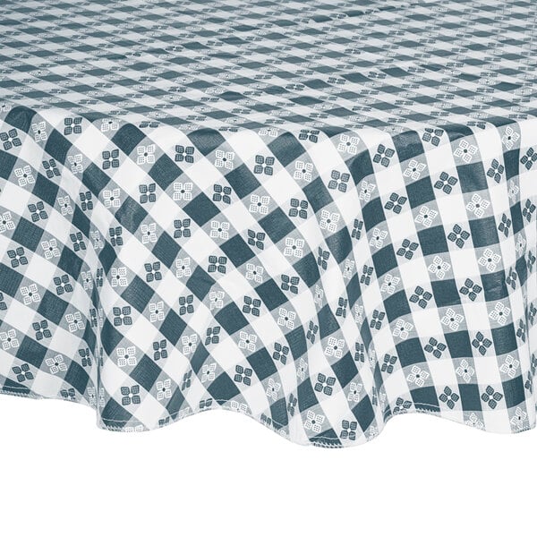 A blue gingham vinyl table cover with a checkered pattern on a table.