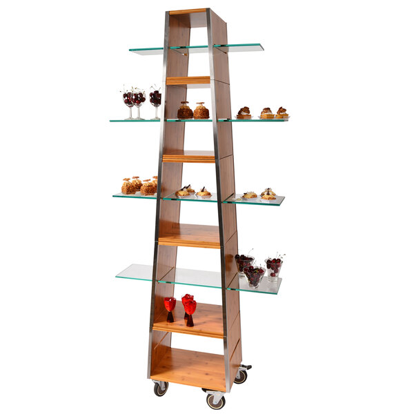 A rectangular Eastern Tabletop acrylic buffet shelf with glass shelves holding cakes in a bakery display.