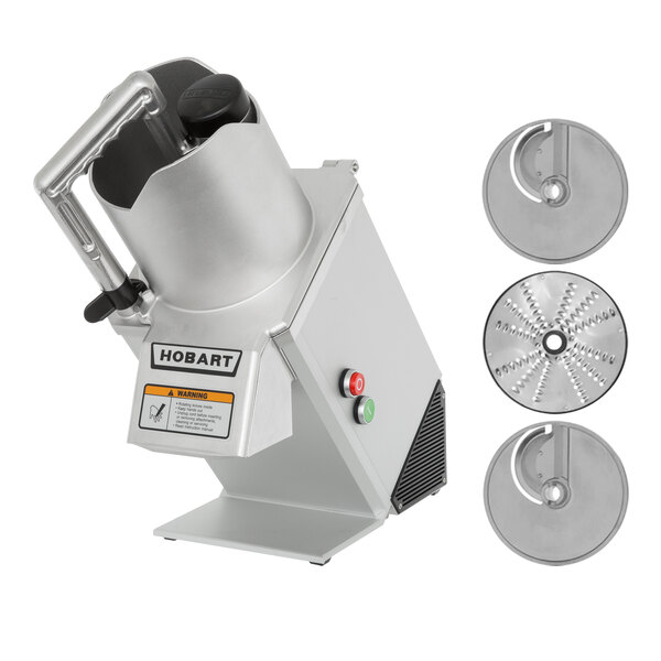 A Hobart commercial food processor with a circular metal pusher and 3 circular metal discs.