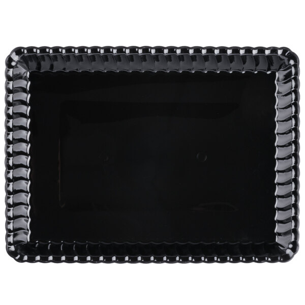 A black plastic rectangular tray with a scalloped edge and a beaded border.