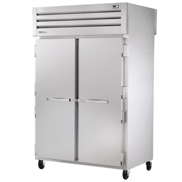 A True reach-in refrigerator with a white door and a handle.