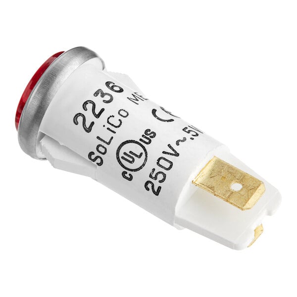 A close up of a white light bulb with a red light.