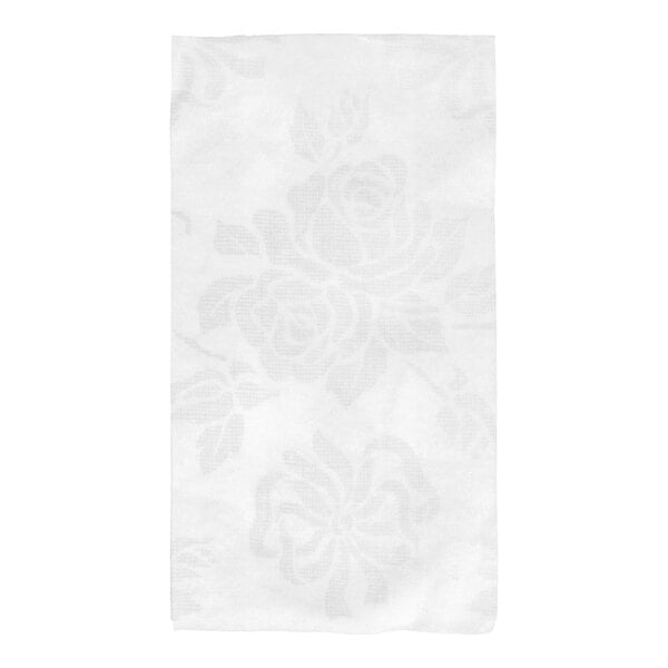 A white linen-like guest towel with a subtle floral pattern.