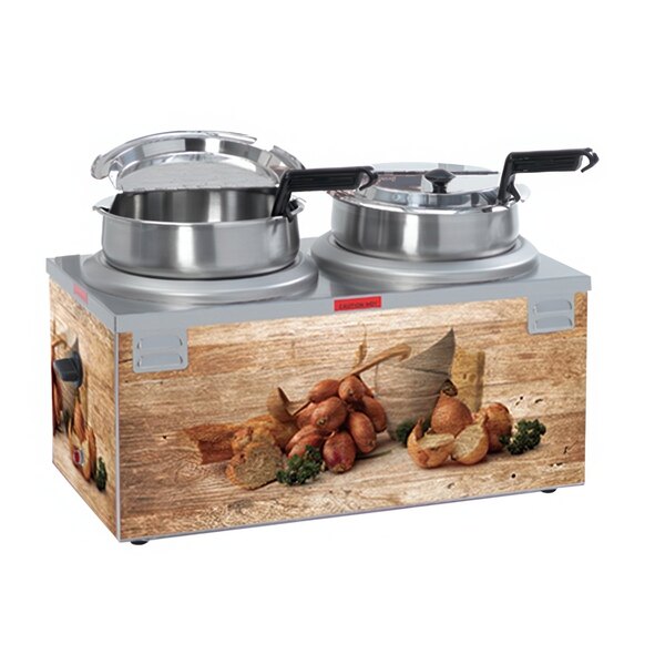 A Nemco countertop soup warmer with two pots of soup in it.