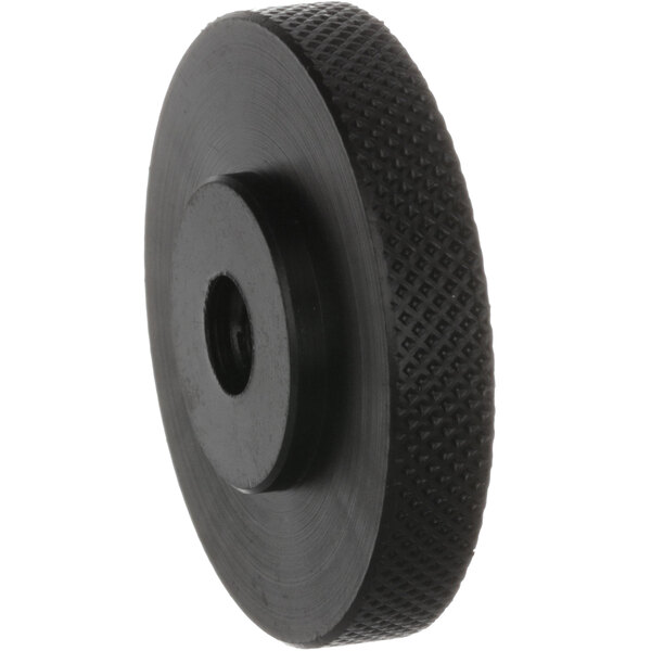 A black plastic Jet Tech knob with a hole in the center.