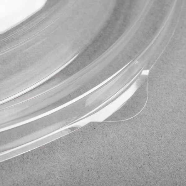 A close up of a clear plastic Sabert dome lid.