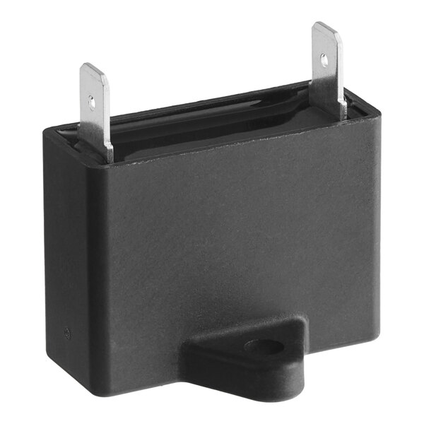 A black rectangular capacitor with metal corners.