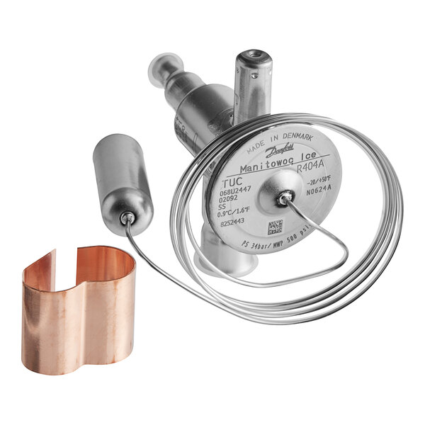 A close-up of a Manitowoc Ice expansion valve with a copper ring.