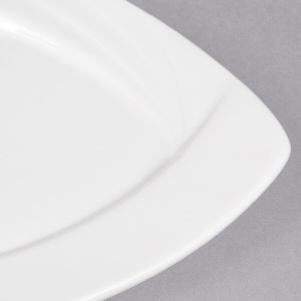 A close up of a CAC Garden State white square porcelain plate.