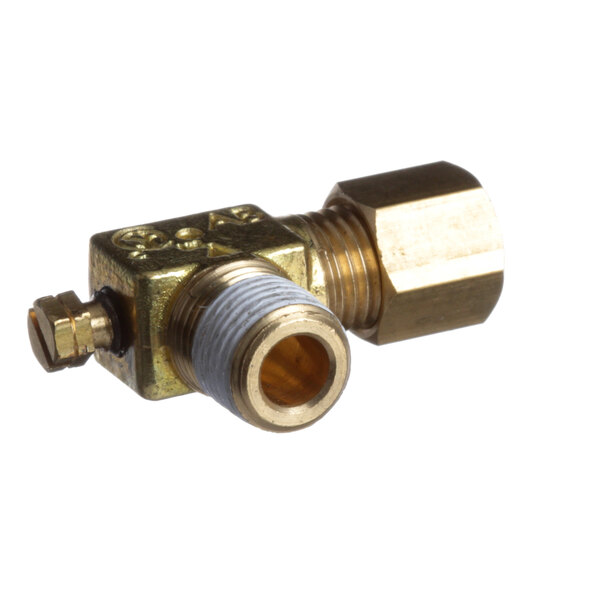 A brass Montague pilot valve with gold and silver metal pieces.