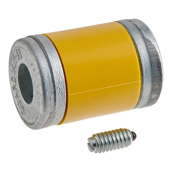 A cylindrical metal and yellow plastic component with a central hole, accompanied by a small metal screw with a rounded tip.