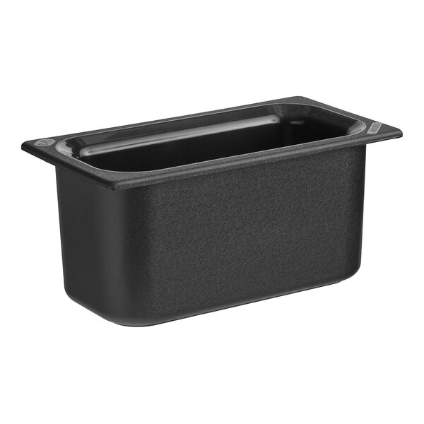 A black Carlisle rectangular plastic food pan with a clear lid.